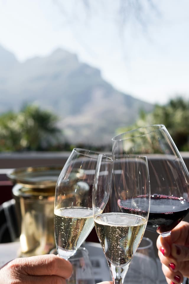 A close-up of a wine glass during a wine tasting event.